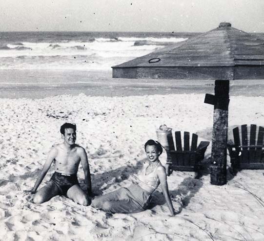 Don and G on the beach on their long vacation after the war